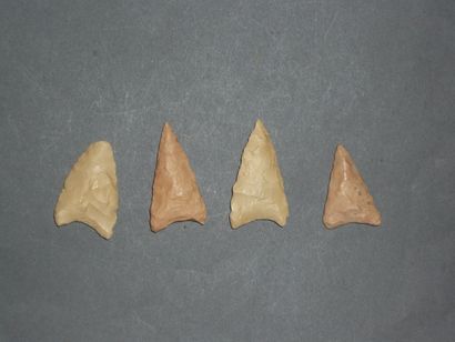 Four white flint arrowheads with wings. Neolithic....