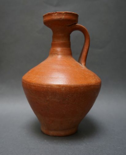 Jug with handle and flared neck in orange...