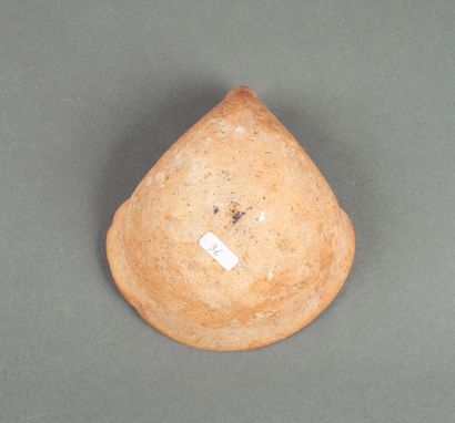 Red earthenware oil lamp with pinched spout.

Phoenicia...