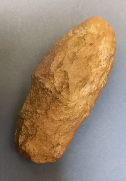 Neolithic polished stone axe with throat.

L:...