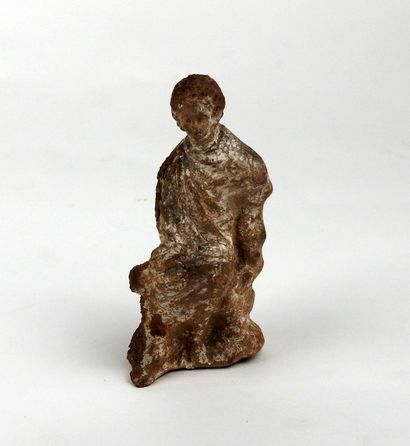 Statuette representing a seated figure, leg...