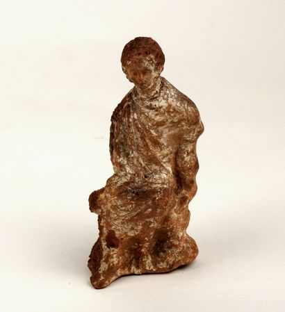 Statuette representing a seated figure, leg...