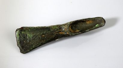 Axe with heel and triangular pattern. 

Bronze....