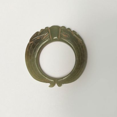 Pale green jade pendant ring in the form...