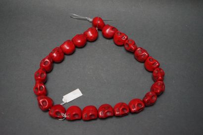 Necklace made of skulls in tinted stone.