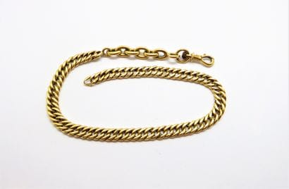 CHAINE DE MONTRE en or jaune 18K (750/°°),...