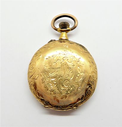 LADY'S GUSPSET WATCH in 18K (750/°°) yellow...