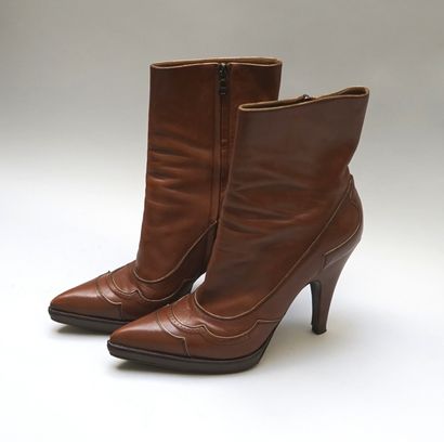 PRADA - Pair of boots with heels and skates...