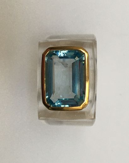 Ring in cut rock crystal, centered with a...