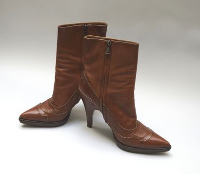 PRADA - Pair of boots with heels and skates...