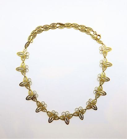 COLLIER draperie en or jaune 18K (750/°°),...