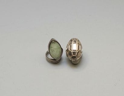 TWO silver rings 925/°°, one curved with...