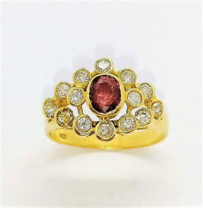 18K (750) yellow gold ring centered on an...