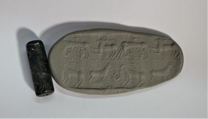 Apocryphal cylinder seal in black hard stone...