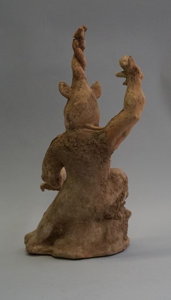 Beige and white terracotta one-horned chimera....