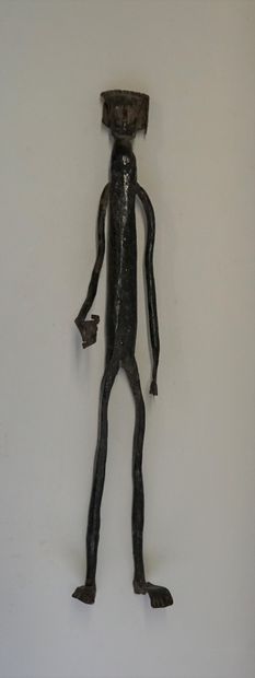 Long standing figure. Iron painted in black....