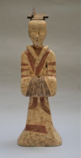 Standing terracotta figure with white, black...