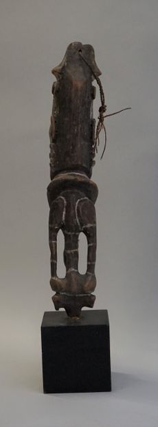 End of a sceptre in the shape of a figure....