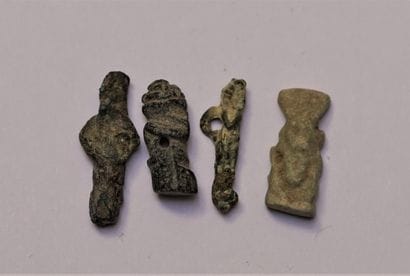 Set of 4 amulets in bronze, stone and enamelled...