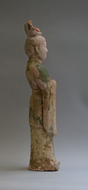 A beige terracotta dignitary or court officer...