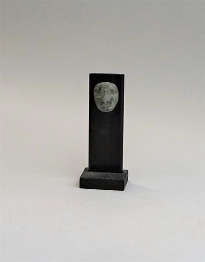 Stylized face with a prominent nose. Green...