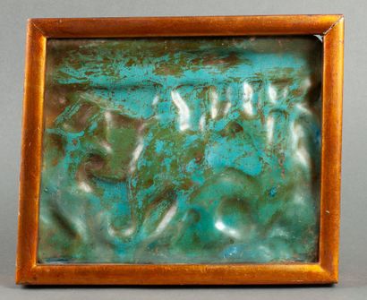 A deep blue earthenware tile depicting an...