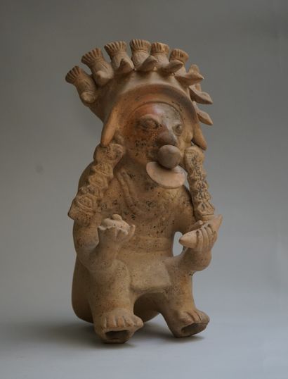 Anthropomorphic figure showing a seated high...