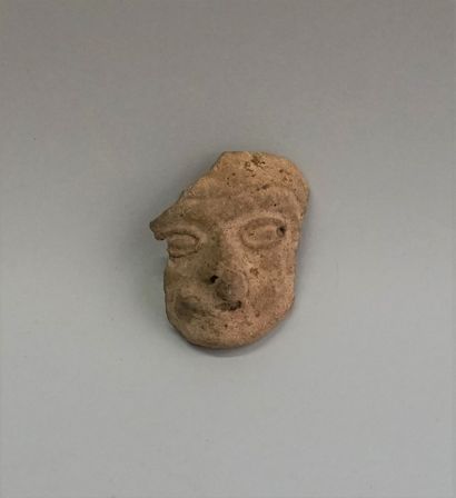 Grey terracotta face.

Guerrero, Mexico (500...