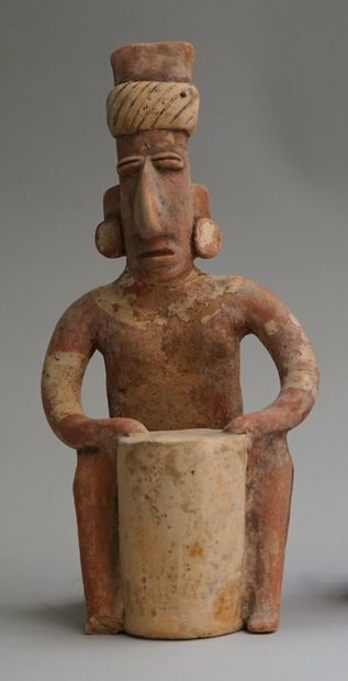 Anthropomorphic sculpture of a seated figure...