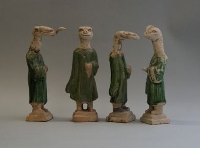 Twelve figures of a procession with heads...