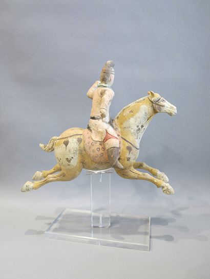 
Polo player riding his mount in a jump....