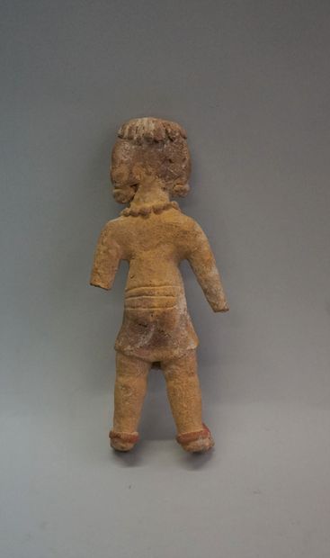 Standing male figure wearing a loincloth....