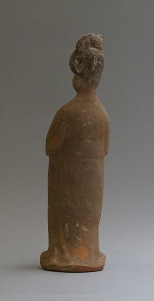 A standing beige terracotta 