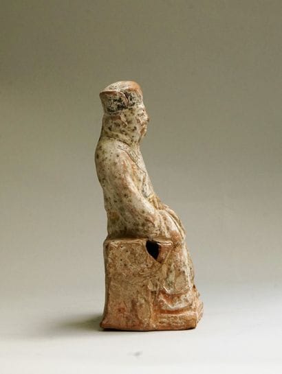 Votive house with character in green and...