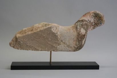 Stylized bird in carved stone with remains...