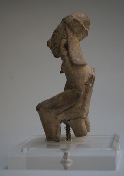 Anthropomorphic statuette showing a female...