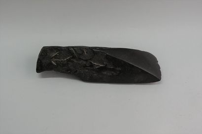 Polished gouge in black and brilliant stone....