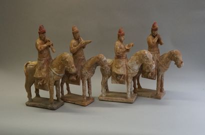 Set of four white, red and black polychrome...