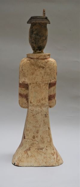 Standing terracotta figure with white, black...