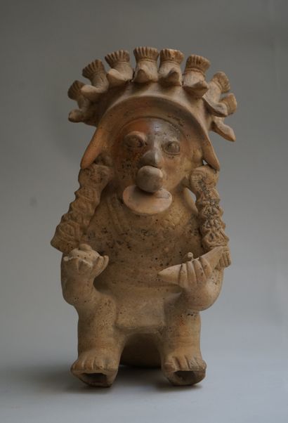 Anthropomorphic figure showing a seated high...