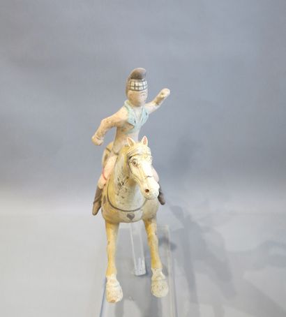 
Polo player riding his mount in a jump....