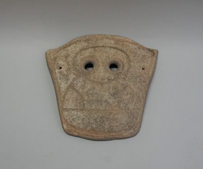Incised terracotta funerary mask with wide-open...
