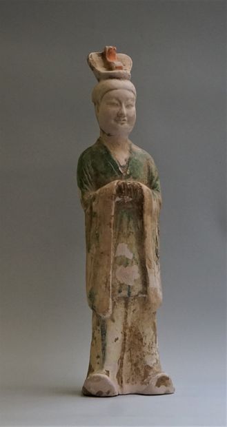 A beige terracotta dignitary or court officer...