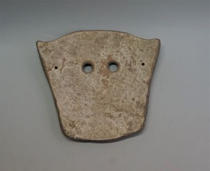 Incised terracotta funerary mask with wide-open...