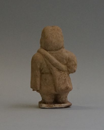 Terracotta dwarf with slight remains of celadon...