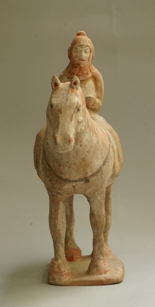 A beige terracotta warrior on horseback with...