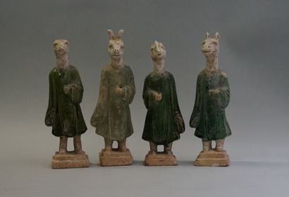 Twelve figures of a procession with heads...