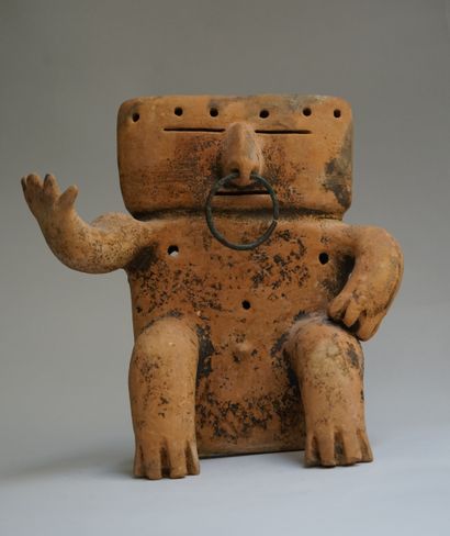 Anthropomorphic statuette showing a seated...