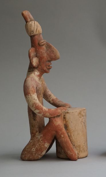 Anthropomorphic sculpture of a seated figure...