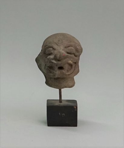 Jaguar head in grey terracotta. It has two...